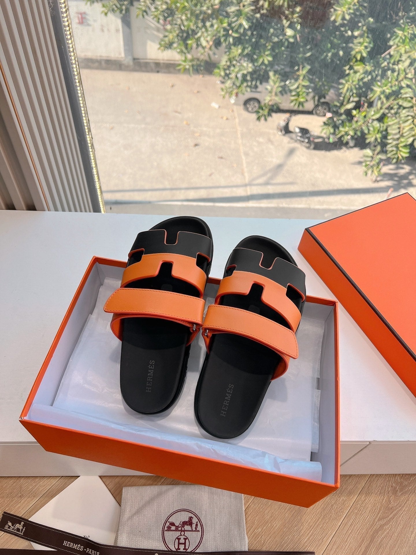 HERMES CHYPRE SANDAL IN VIVID ORANGE MIX BLACK CALFSKIN